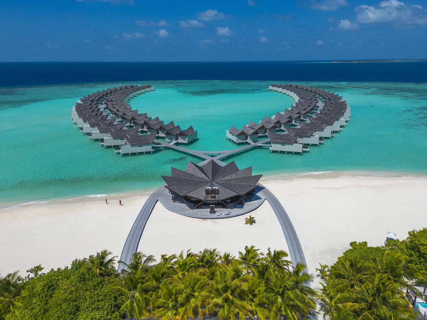 Large hotel resort on a sandy beach and turquoise ocean