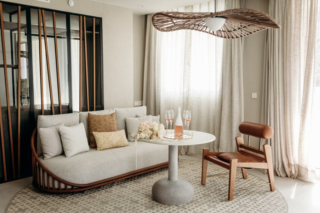 Mondrian Ibiza suite with sea view and wedding setting with white flowers and rose champagne