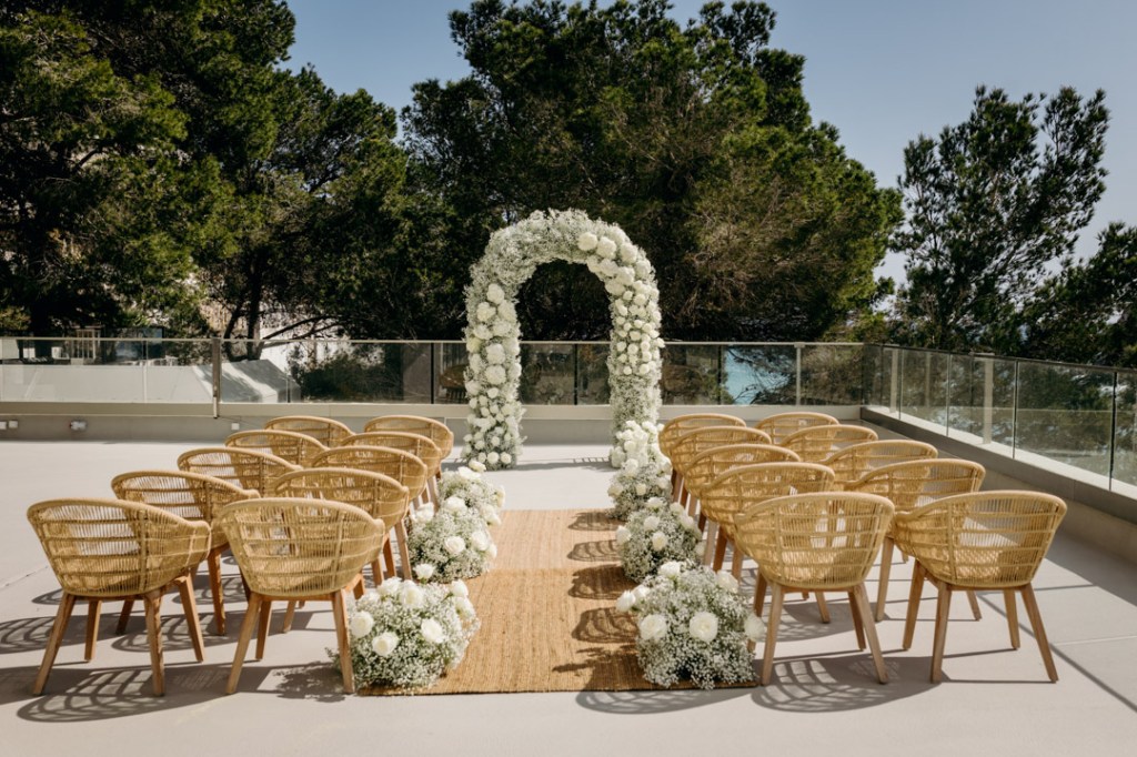 Mondrian Ibiza outdoor terrace with sea view and wedding setting with white flowers
