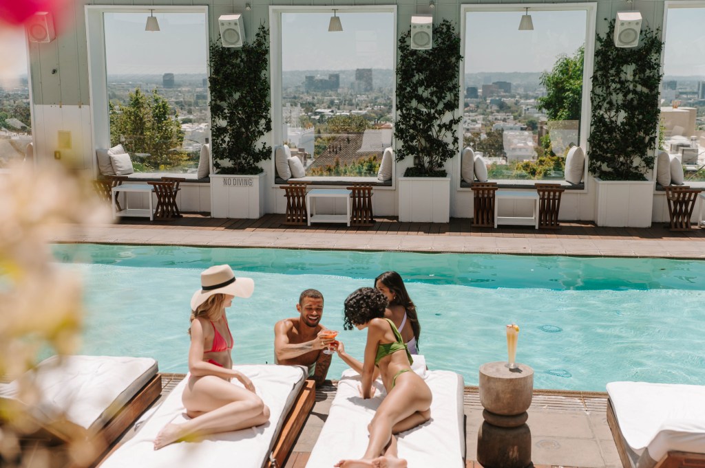 Friends lounging poolside