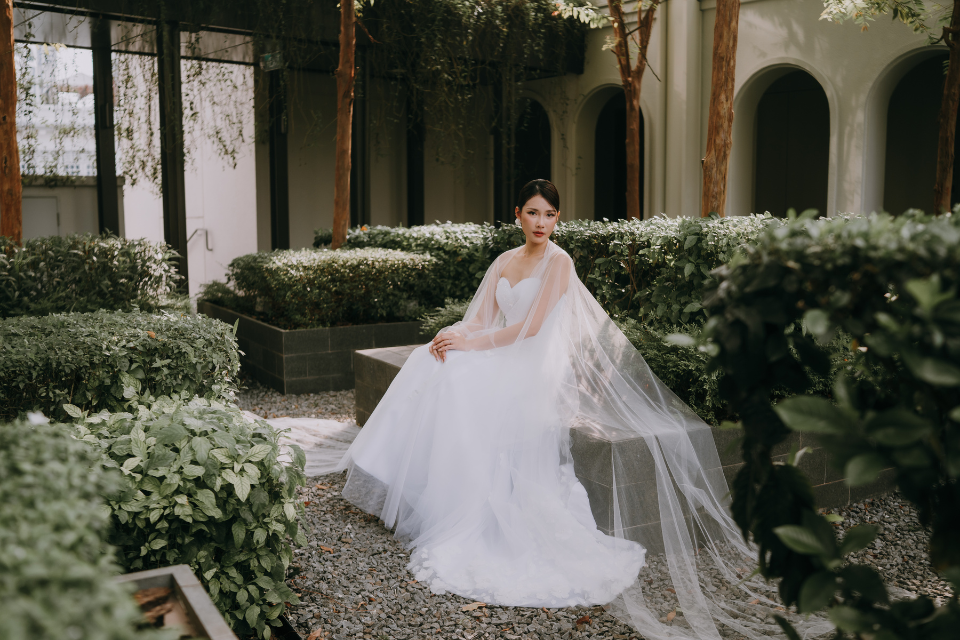 bride posing at a garden