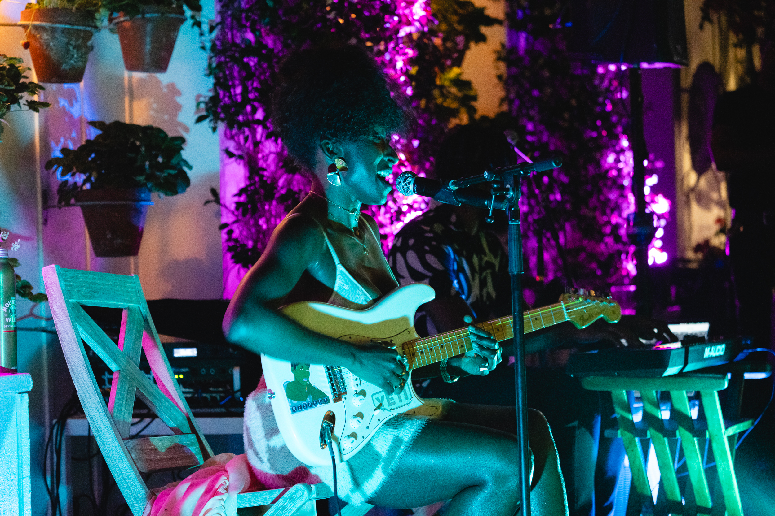 Girl singing on a acoustic guitar