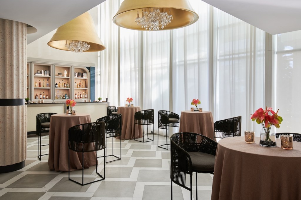 Ballroom with several high-top tables and chairs