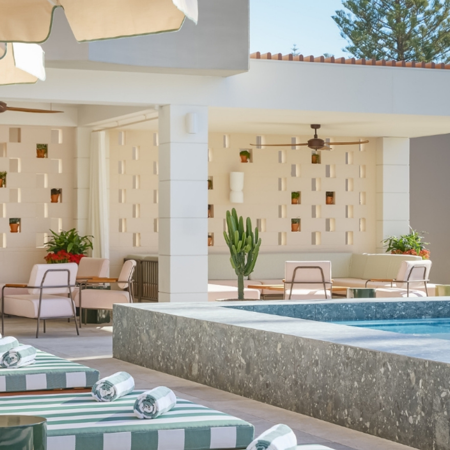 pool and striped chaise lounges