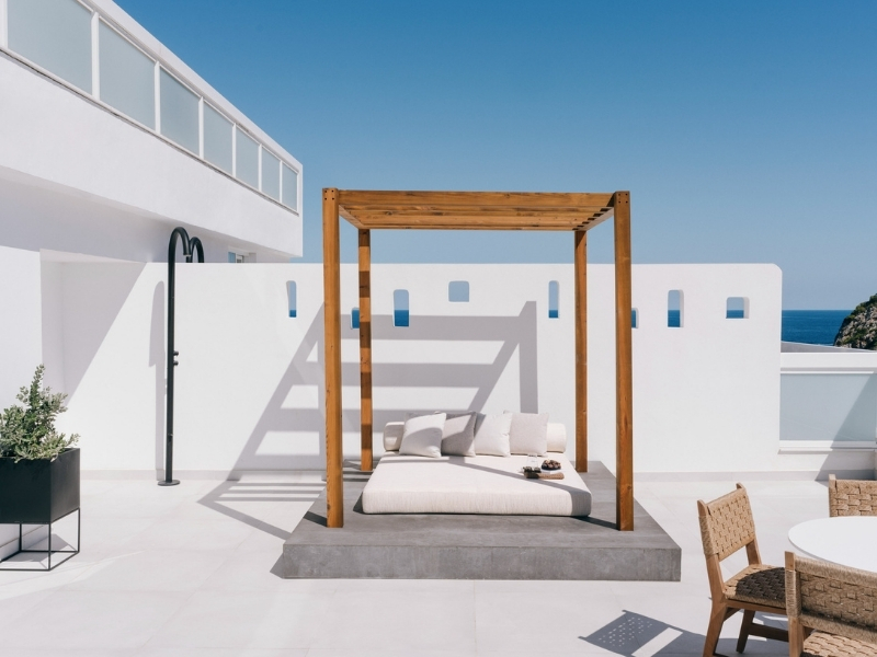 white daybed on a balcony