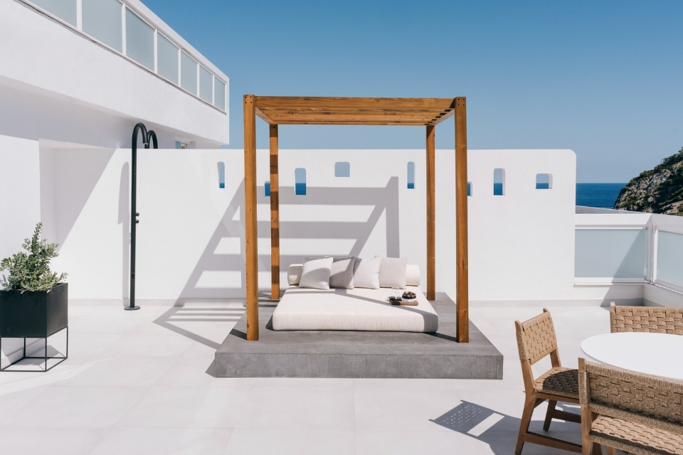 white daybed on a balcony